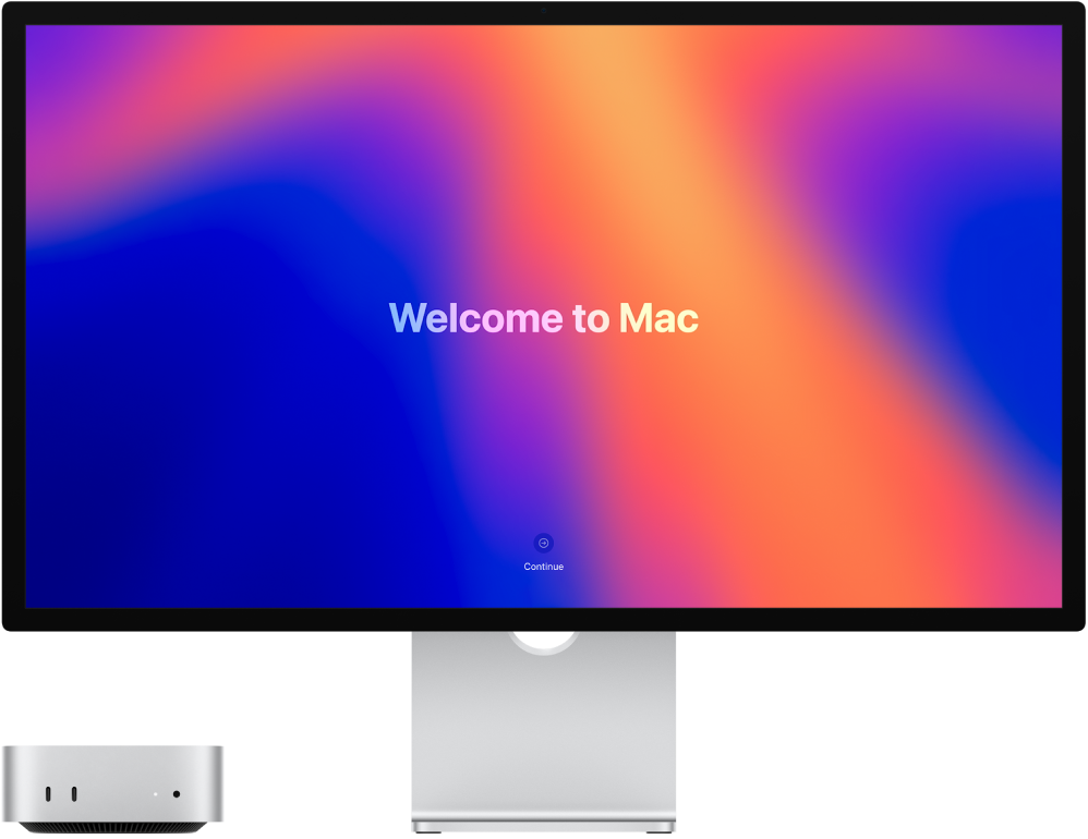 Egy Mac mini és egy Studio Display egymás mellett a „Welcome to Mac” mondattal a képernyőn.