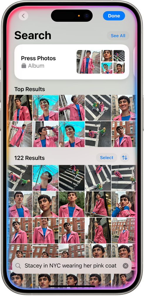 ଫଟୋ ଆପ୍ରେ iPhone ଫଟୋ ଦେଖାଉଛି। ସ୍କ୍ରୀନ୍ର ନିମ୍ନରେ ଏକ ବର୍ଣ୍ଣନା ସହିତ ଏକ ସର୍ଚ୍ଚ୍ ବାର୍ ଦେଖାଉଛି।